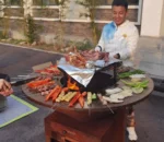 New Trends Modern Durable Outdoor Kitchen Barbecue Grill Corten Steel Charcoal Fire Table with Trolley and Flame Safety Device