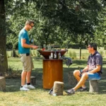 Modern Corten Steel Fire Pit Barbecue Grill with Trolley and Flame Safety Device-Outdoor Charcoal Grill