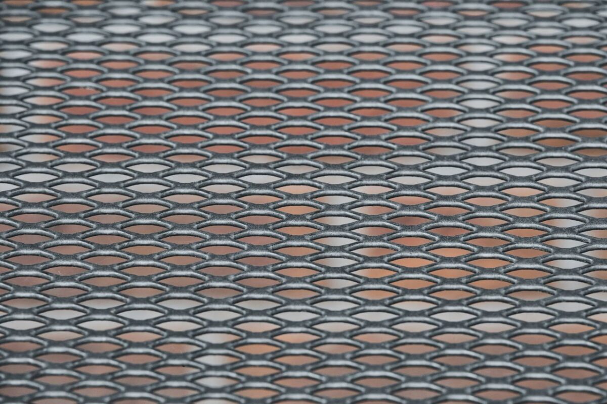 Decorative laser-cut metal privacy screen panel outdoors