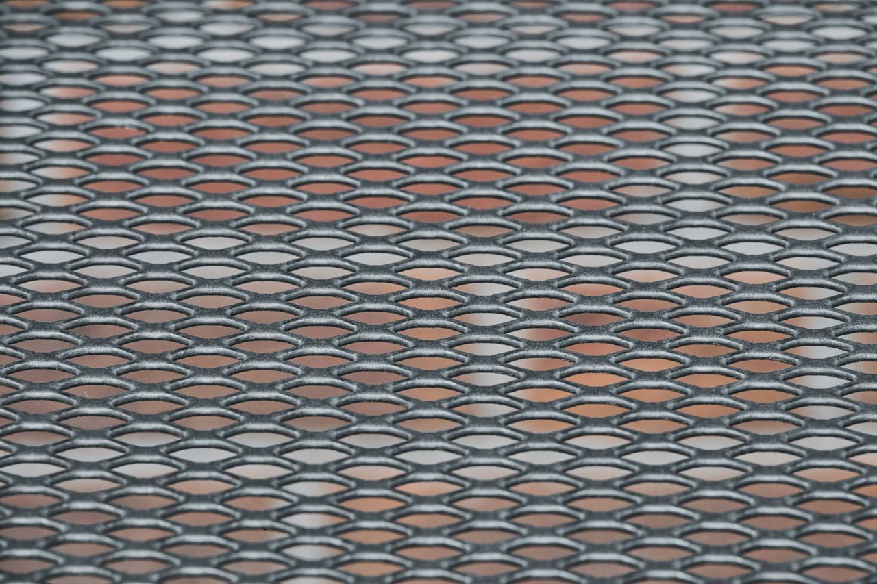 Decorative laser-cut metal privacy screen panel outdoors