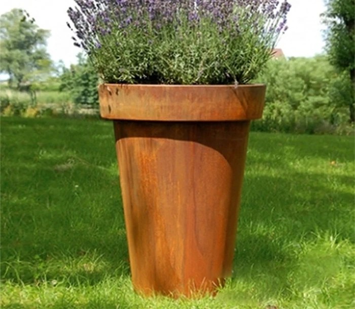 Corten steel tapered planter with lavender in a New Zealand garden setting