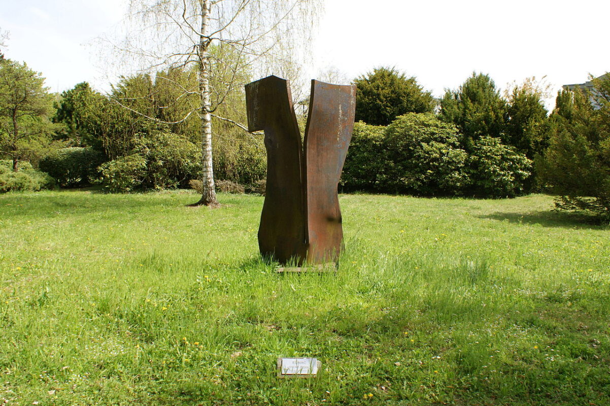 Weathering steel art feature in a garden setting for Malaysia