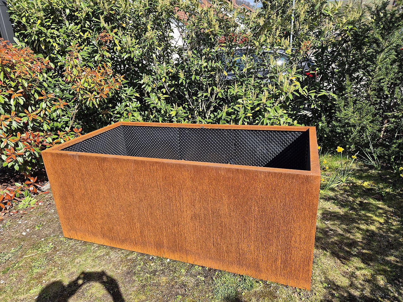 Real Corten steel raised garden bed with weathered patina for UK commercial landscape specification