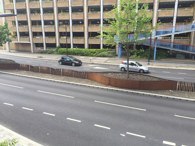 Real corten steel planter and central barrier in Peterborough UK streetscape