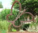 Germany France corten steel public art sculpture in planted landscape